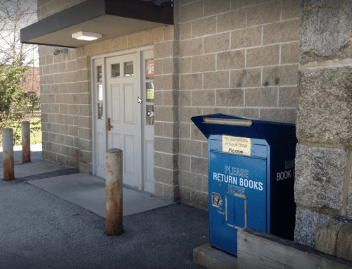Whitinsville Social Library exterior book return drop box and entrance door for after-hours returns